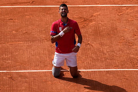 Serbia's Novak Djokovic reacts after winning Paris Olympics Tennis gold